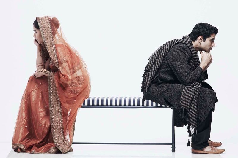 Indian divorce documents with gavel and marriage certificate.